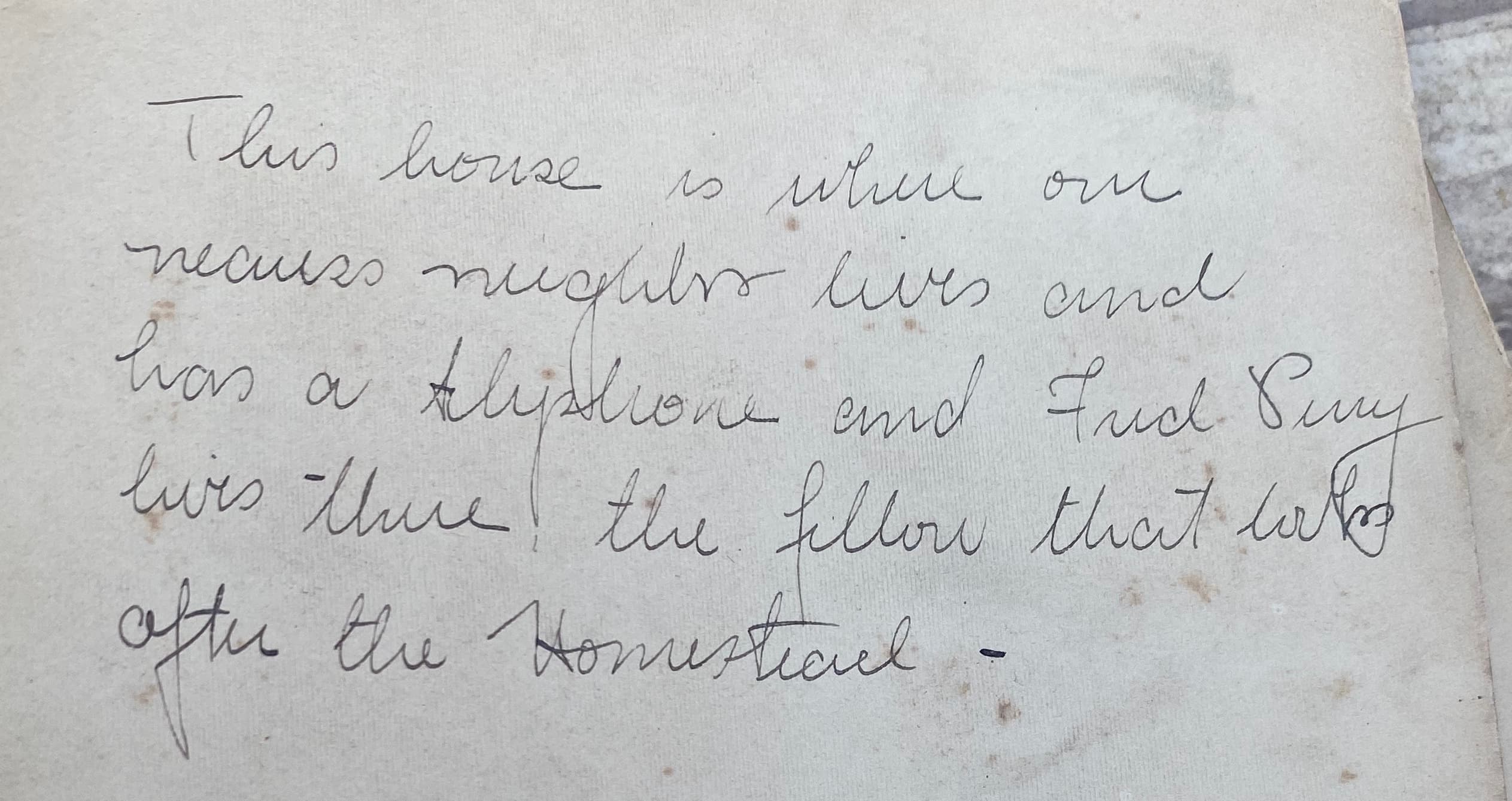 Back of house and barn photo with Fred Bury note