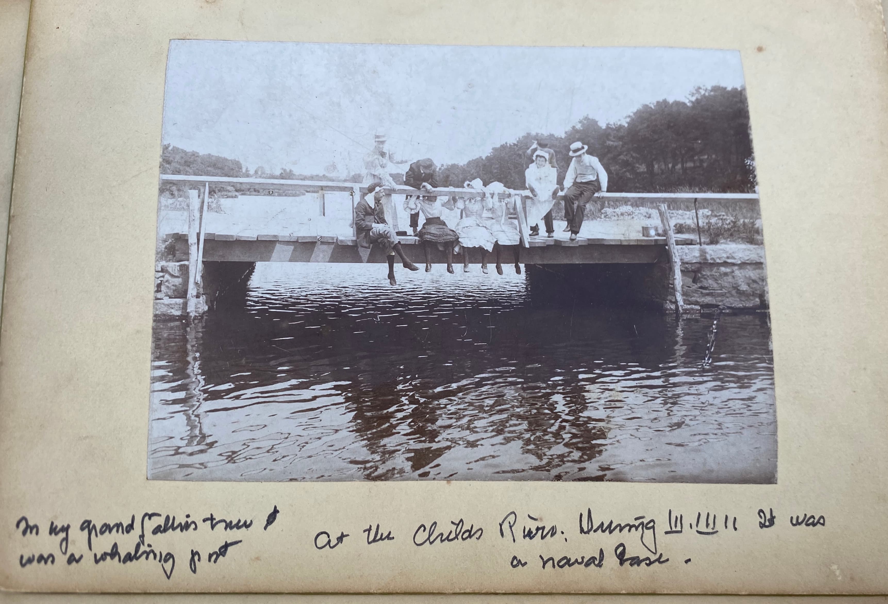 Group on bridge, facing camera, Childs River
