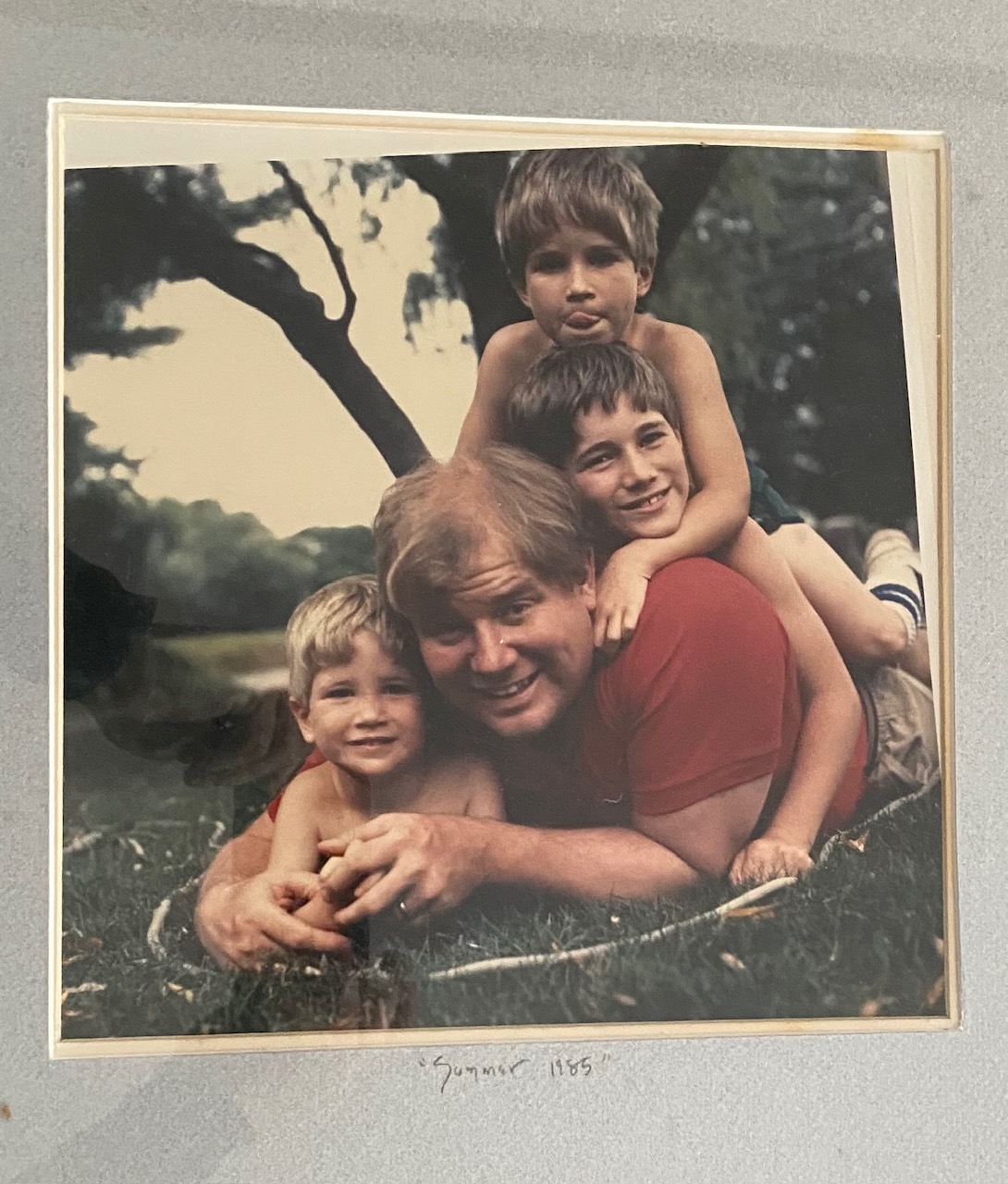 The family, 1985. Drift Road. Perry, Patrick, John, and our dad in the front yard by the tree. He always showed up.